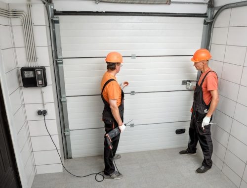 workers-are-installing-lift-gates-garage_191163-1849